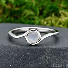 a close up of a ring on a rock