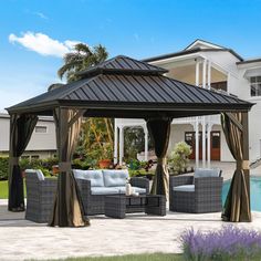 a gazebo sitting next to a swimming pool