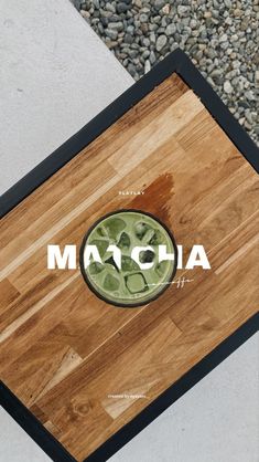 a close up of a cutting board with the word matcha on it