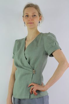 "Write the selected color in the message Handmade moss green linen blouse, perfect for casual wear and suitable for any occasion in any season Details: - 100% natural linen produced in Europe ; - medium weight (180 gram per square meter); - color: moss green, could be any from our colors catalog (color samples at the photo); Made to order, approximately a few days, If you have any questions please message me and I will be glad to answer. Size guide : Size XS Bust: fits bust around 33\"-34\"/ 84- Fitted Linen V-neck Wrap Top, Chic Green Linen Top, Elegant Green Wrap Top, Fitted Linen Wrap Blouse, Elegant Green Linen Top, Green Linen Blouse For Workwear, Linen Casual Dress, Natural Linen Dress, Color Catalog