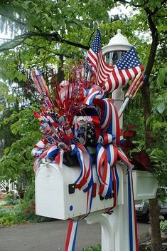 a mailbox decorated with american flags and streamers