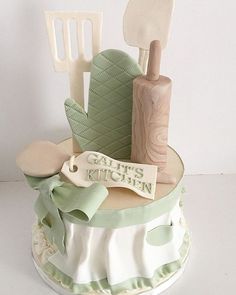 there is a cake made to look like it has utensils and other things on top