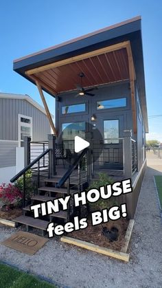 tiny house feels big in front of a building with the words tiny house feels big