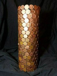 there is a vase made out of coins