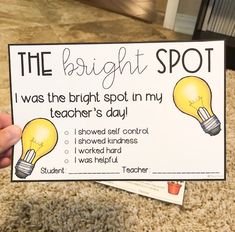 a hand holding up a sign that says the bright spot i was the bright spot in my teacher's day