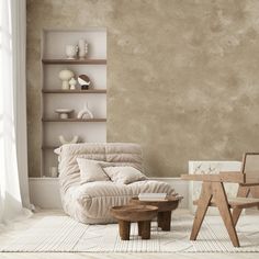 a living room with a chair, table and shelves