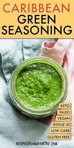 a jar filled with green seasoning on top of a table