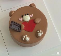 there is a chocolate cake with hearts and bears on it