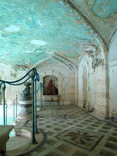 the inside of an old building with tiled floors and walls