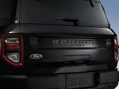 the rear end of a black ford bronco