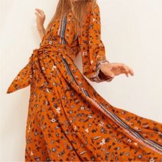 So Comfy And Flattering Orange Long Sleeve Printed Maxi Dress, Orange Long Sleeve Maxi Dress For Vacation, Bohemian Orange Maxi Dress For Spring, Orange Long Sleeve Maxi Dress For Summer, Flowy Orange Floral Print Midi Dress, Orange Printed Spring Dress, Orange V-neck Boho Print Maxi Dress, Flowy Orange Floral Print Dress, Orange Bohemian Boho Dress With Floral Print