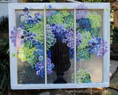 a window with flowers painted on it