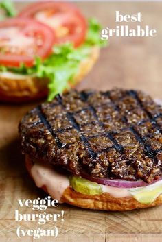 a hamburger sitting on top of a wooden cutting board