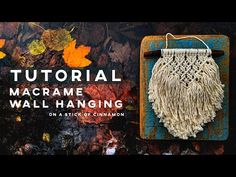 an image of macrame hanging on a wall with autumn leaves in the background