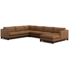 a brown leather sectional sofa sitting on top of a white floor