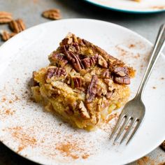 a piece of pecan pie on a plate with a fork