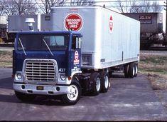 a large semi truck parked in a parking lot