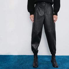 Zara Black Faux Leather Joggers. Jogger Style Pants In A Sleek Smooth Black Faux Leather. Features Faux Leather Scrunched Ankle Cuffs, Super Deep Large Side Pockets. High Waisted. Brand New With Tags! Marked As A 00 But They Have Very Oversized And Would Fit Best As A Size Small (Please Double Check Measurements To Make Sure) Measurements 14” Waist 36” Long 24” Inseam Zara Leather Joggers, Chic Winter Streetwear Pants, Chic High Waist Leather Pants For Streetwear, Chic Leather Pants For Streetwear, Chic High-waist Leather Pants For Streetwear, Chic Leather Pants For Fall Streetwear, Black High-waisted Leather Pants For Streetwear, Chic Leather Bottoms For Streetwear, Wide Leg Leather Pants For Fall Streetwear