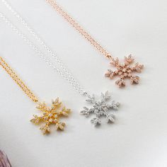 This snowflake necklace symbolizes beauty, spotless, pure and noble. The delicate design makes you always beautiful and charming, perfect for Christmas gifts, or as a lucky charm, always reminds the people you love, how unique and wonderful they are, just like snowflakes. Pendant Size: 25mm / 1 inch radius Necklace length: 45 cm / 17 inch • Finish: 925k Sterling Silver / 18K Gold Plated / Rose • It's dainty and can be worn every day • A special piece you'll treasure • High quality materials and Silver Snowflake Necklace For Holiday, Elegant Festive Jewelry For Winter, Elegant Winter Jewelry As Gift, Elegant Winter Holiday Jewelry, Winter Snowflake Necklace, Elegant Silver Necklace For Winter, Silver Jewelry As Winter Gift, Silver Jewelry For Winter Gift, Silver Necklace For Christmas Gift For Her