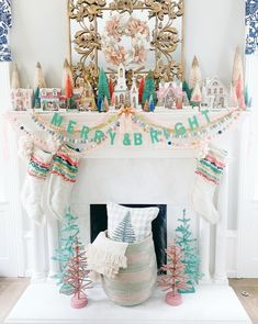 a fireplace decorated for christmas with stockings and decorations