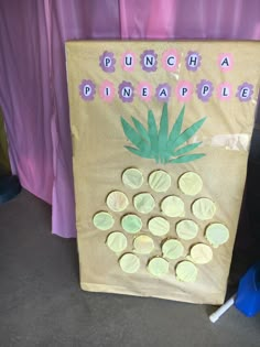 a paper bag that has some pineapples on it and the words punch a pineapple