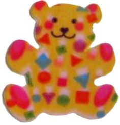 a yellow teddy bear with multicolored shapes on it