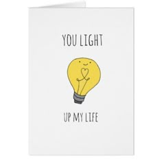 a yellow light bulb with the words you light up my life