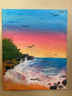 an acrylic painting of birds flying over the ocean at sunset with rocks in foreground