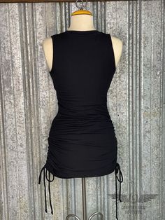 This Allie Dress is the perfect little black dress!! It is made with a medium/ light weight small ribbed material with drawstring ruching on the side. The dress length can be adjusted by the side draw stings. If you want a longer dress with less ruching, just tie it where you want it to hit. If you want a shorter dress with more ruching, just tie the strings higher. It is cute, comfortable, and versatile! + Black color + Fits true to size. It is body hugging and flattering. + Adjustable length + Black Stretch Dresses With Drawstring, Black Stretch Dress With Drawstring, Black Summer Dress With Ruched Detail, Black Stretch Mini Dress With Tie Back, Black Ribbed Elastane Dress, Side Dress, Facebook Black, Color Fits, Perfect Little Black Dress