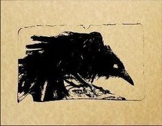 a black bird sitting on top of a piece of paper