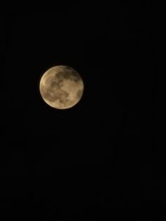 the full moon is seen in the dark sky