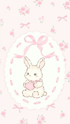 a cute little bunny holding a pink heart