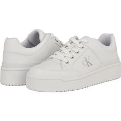 Calvin Klein Aubrie White Logo Low Top Sneakers - New In Box Stay Timelessly Stylish With Your Simple Yet Sleek Look Wearing The Calvin Klein Aubrie Sneakers. The Low-Top Footwear Features Faux Leather Upper Construction With Textile Lining And Eva Footbed. With A Round Toe Silhouette, The Pair Has Lace-Up Closure And Synthetic Rubber Outsole. Padded Collar And Tongue. Branding Along The Lateral Side. White Platform Sneakers With Branded Heel, Calvin Klein Sneakers Women, Calvin Klein Sneakers, Calvin Klien, White Calvin Klein, Calvin Klein Shoes, Floral Sneakers, Uniqlo Bags, Vintage Chanel Handbags