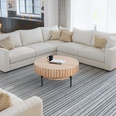 a living room filled with furniture and a coffee table