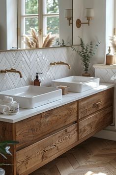 a bathroom with two sinks and mirrors on the wall next to each other in front of a window