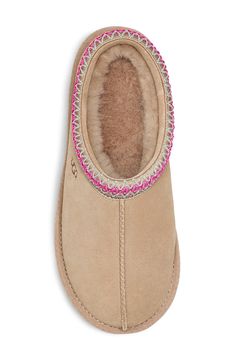 A warm, suede slipper with embroidered trim and a plush genuine-shearling lining can be worn in or out of the house thanks to the grippy sole. Slight dye transfer may occur with darker colors during first few wears Leather upper/genuine-shearling or genuine-shearling and UGGpure wool lining/rubber sole Shearling may be sourced from Australia, Ireland, Spain, the UK or the USA. See packaging for confirmed country of origin UGGpure, a moisture-wicking textile made entirely from wool but crafted to Slippers Aesthetic, Uggs Slippers, Cute Uggs, Ugg Tasman Slippers, Ugg Tasman, Shoe Wishlist, Cute Nike Shoes