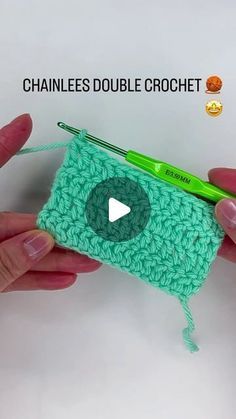 two hands holding a green crochet pouch with a video in front of it