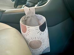 a cup holder in the back seat of a car