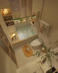 an aerial view of a bathroom with a sink, toilet and bathtub in it