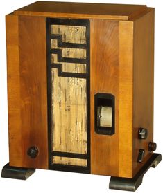 an old fashioned wooden radio sitting on top of a stand