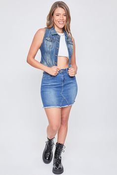 It’s giving biker babe! Our Women’s Vintage Denim Vest is the perfect 90’s throwback mixed with some edginess. We’ve designed this vest with special treatments and fading to embody the look of denim in the 90’s. This vest also has a fitted and cropped silhouette. Featuring a 6-button front closure with 2 front patch pockets. For a 90s look, pair with denim jeans and platform sneakers. For a more modern take, pair this vest with a black mini skirt and tall black boots!Product Details- 5-Button Closure- 2 Front Flap Pockets- FadingSize & Fit (based on size M)- Length: 19”- Chest: 17"- Model is wearing a size SMachine wash cold.Tumble dry low.66% Cotton/ 27% Polyester/ 6% Rayon/ 1% Spandex (Color: J200 Medium Blue) Spring Dark Wash Denim Vest With Frayed Hem, Dark Wash Denim Vest With Frayed Hem, Edgy Denim Jacket With Frayed Hem, Trendy Medium Wash Vest, Fall Medium Wash Denim Vest, Trendy Fitted Medium Wash Vest, Fitted Trendy Medium Wash Vest, Denim Blue Denim Vest With Frayed Hem, Denim Blue Frayed Hem Denim Vest