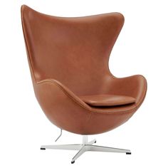 the egg chair is shown in tan leather