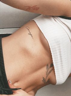 a woman with a tattoo on her stomach