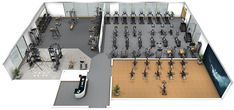 an overhead view of a gym with rows of exercise bikes and treadmills in the center