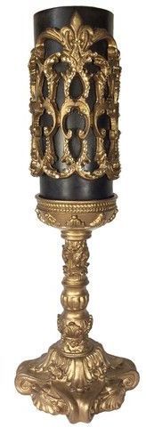 an ornate gold and black candle holder