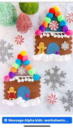 two gingerbread houses made out of felt with candy and snowflakes around them