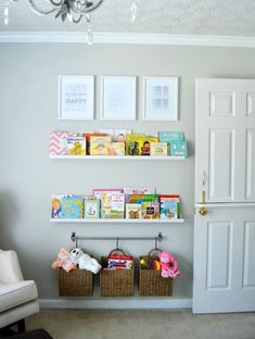 two bookshelves filled with children's books on top of white shelves in a room