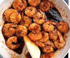 a pan filled with cooked shrimp and sauce