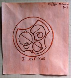 a piece of paper with a drawing on it that says i love you and two people