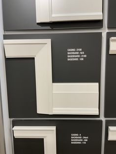 some white and black cabinet doors with labels on the front, back and side panels